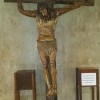 This is a crucifix near the entrance of the EDSA Shrine that is facing EDSA. The statue of Jesus is brown, and unlike a typical crucifix, the position of his arms are asymmetrical, with left arm in straight diagonal position while the right arm is bending at an L-shape. The wood that makes up the cross are raw cylindrical logs.